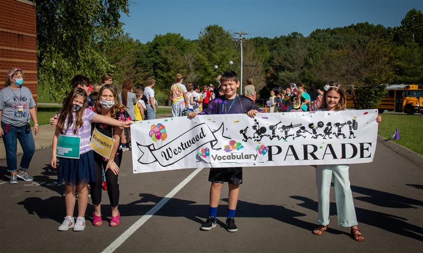 Students walk in a vocabulary parade